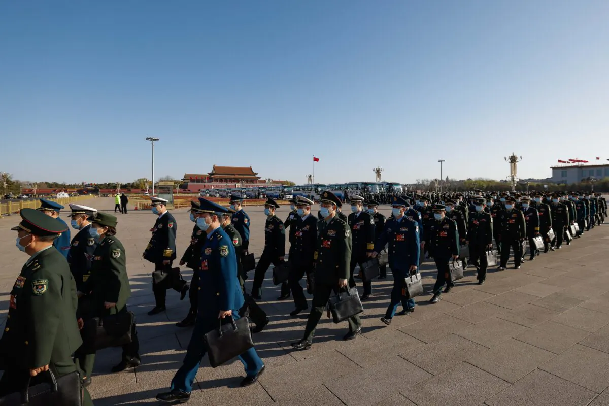 Delegates arrive to the fifth plenary session of the National People's Congress in Beijing on March 12, 2023. (Lintao Zhang/Getty Images)