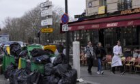 Paris Sanitation Union Ends Strike; Workers Begin to Clear Tons of Garbage