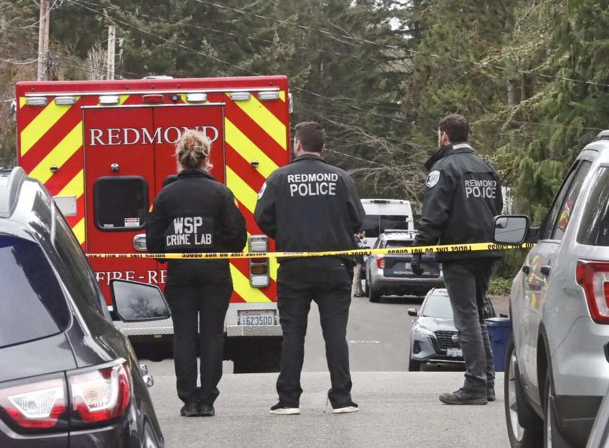 Police gather at NE 89th Street in Redmond, Wash., on March 10, 2023. (Greg Gilbert/The Seattle Times via AP)