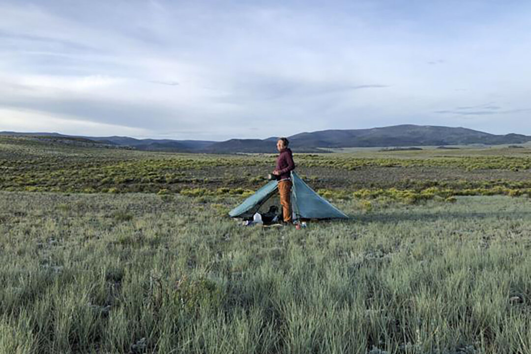 India Wood sets up camp in a sage field in southwest Colorado during her multiyear mission to crisscross the state on foot, corner to corner. (Courtesy of India Wood/TNS)