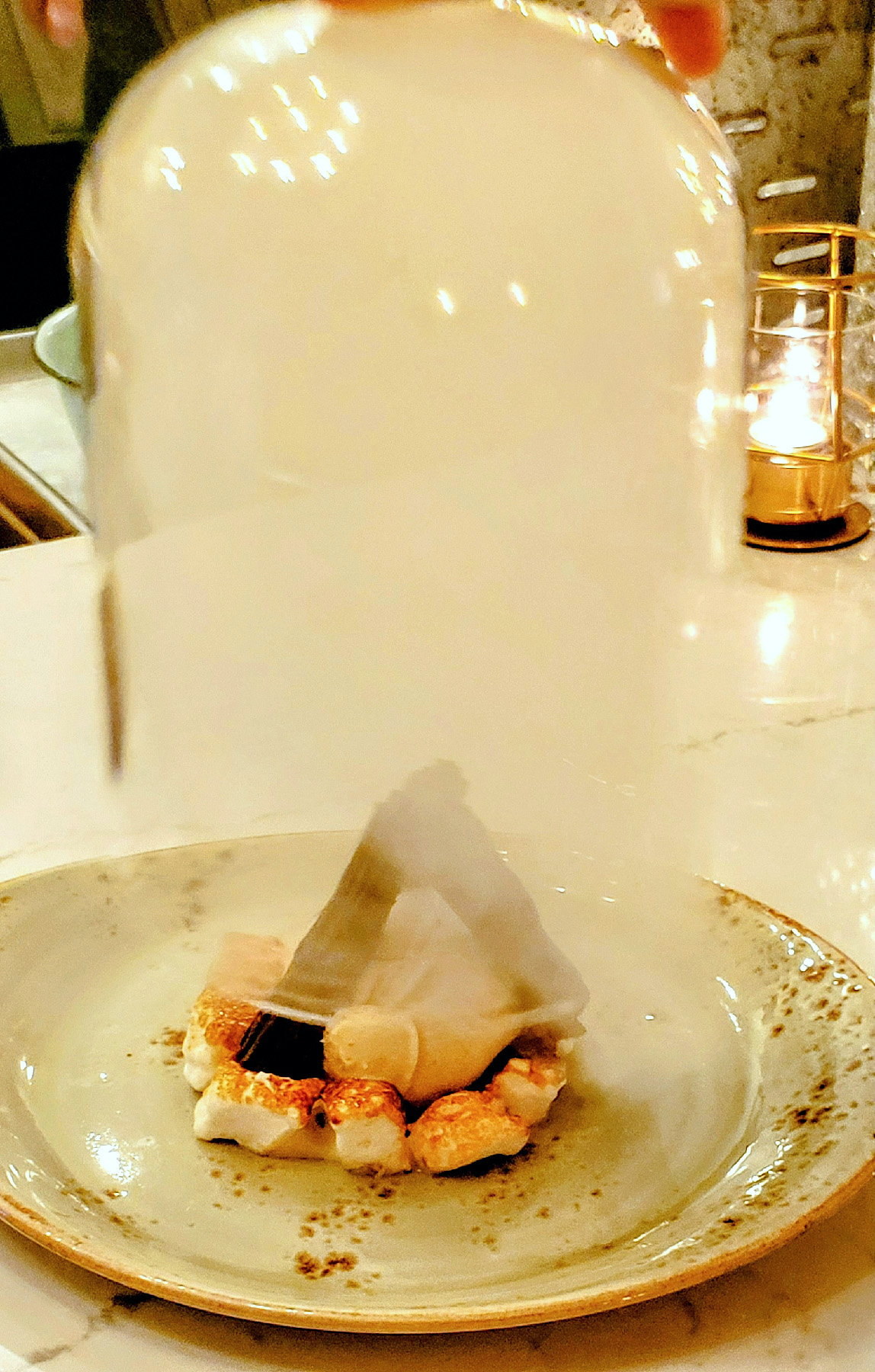 The dessert s’mores at Crafted in Yakima, Washington, are served under a smoky bell jar.
