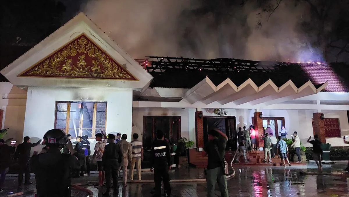 Local authorities try to put out a fire at Royal Residence in Siem Reap, Cambodia, on March 12, 2023. (AKP via AP)