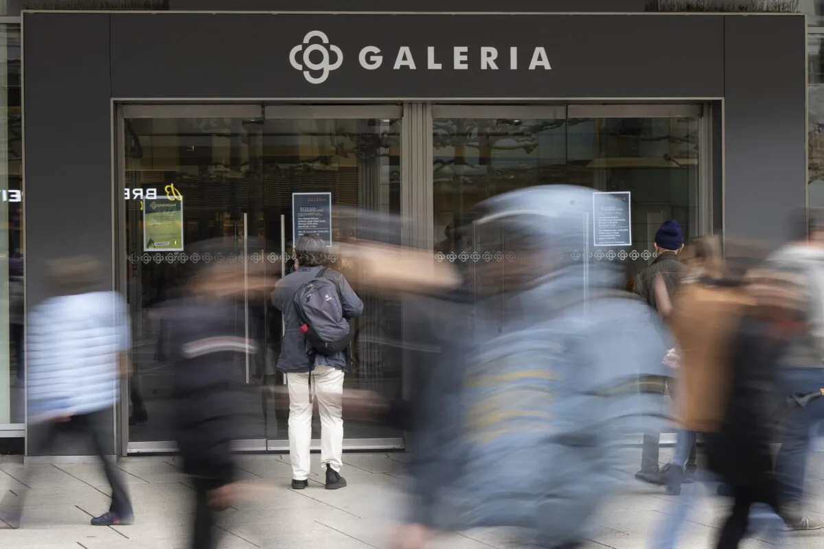 People walk past the entrance to Galeria Kaufhof on Frankfurt's Zeil, Germany, on March 13, 2023. (Sebastian Gollnow/dpa via AP)