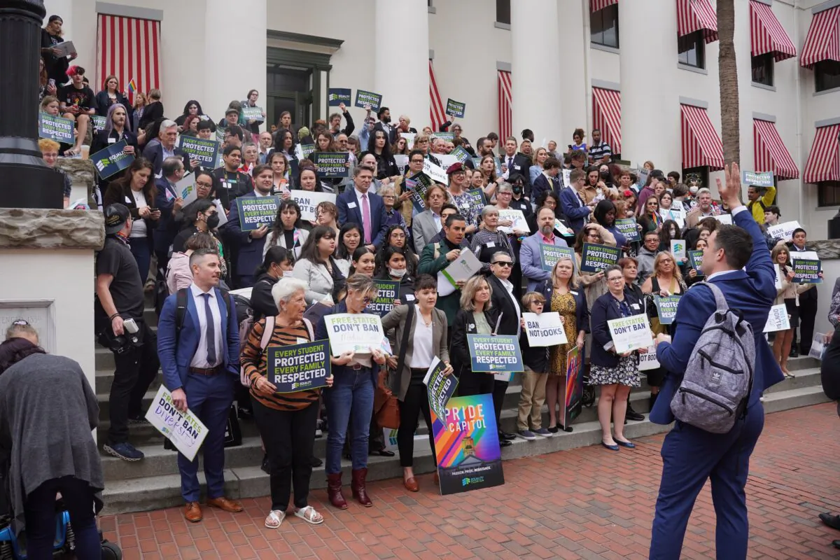 A rally leader organizes nearly 200 protesters at an Equality Florida demonstration at the Florida Capitol in Tallahassee on March 13, 2023. (Dan M. Berger/The Epoch Times)