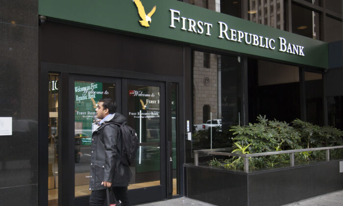 A man stands outside First Republic Bank in downtown San Francisco. (Lear Zhou/The Epoch Times)