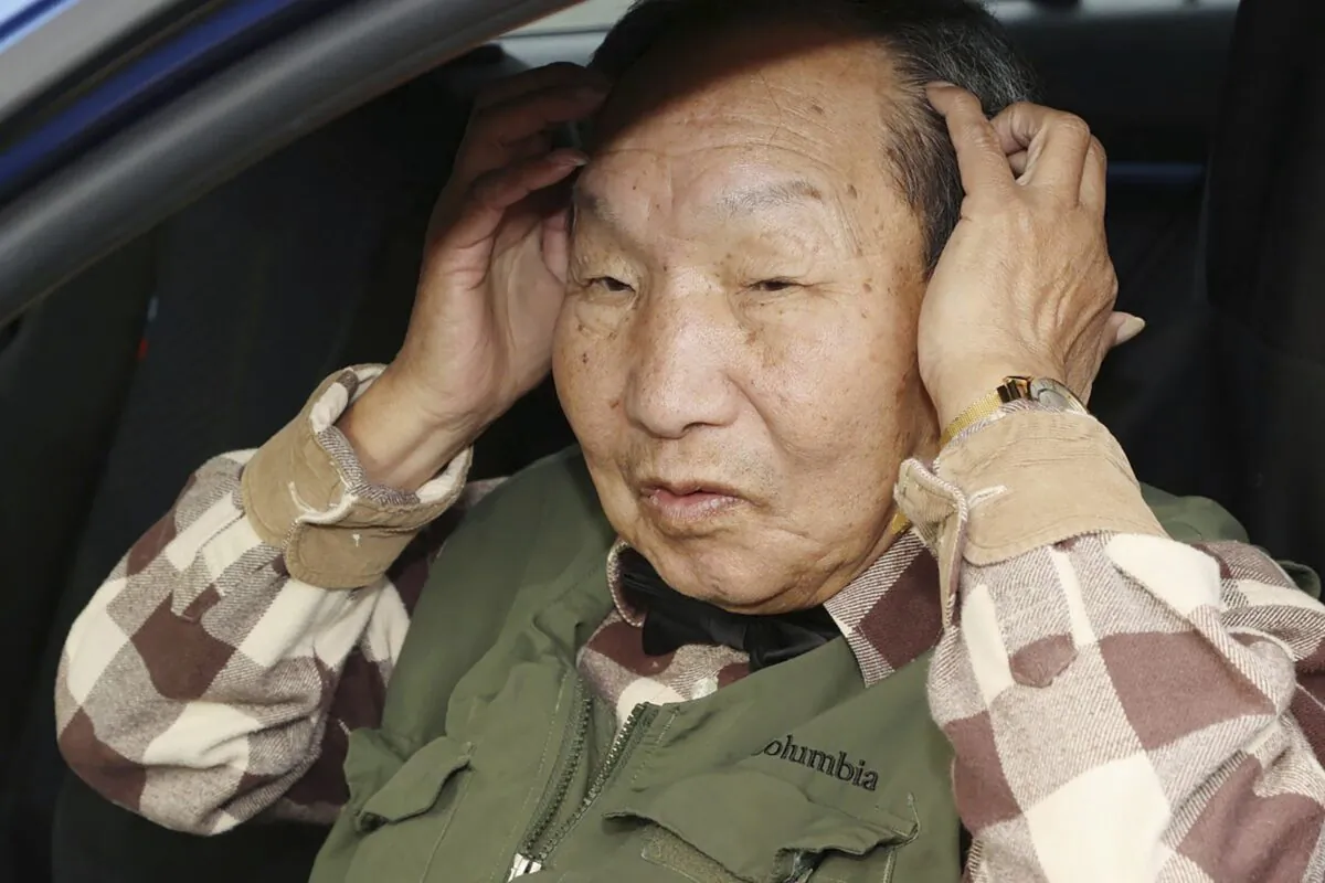 Iwao Hakamada answers reporters' questions after a walk in Hamamatsu, Shizuoka prefecture, central Japan, on March 13, 2023. (Kyodo News via AP)