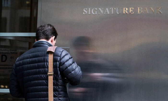 A worker arrives to the Signature Bank headquarters in New York on March 12, 2023. (Eduardo Munoz/Reuters)