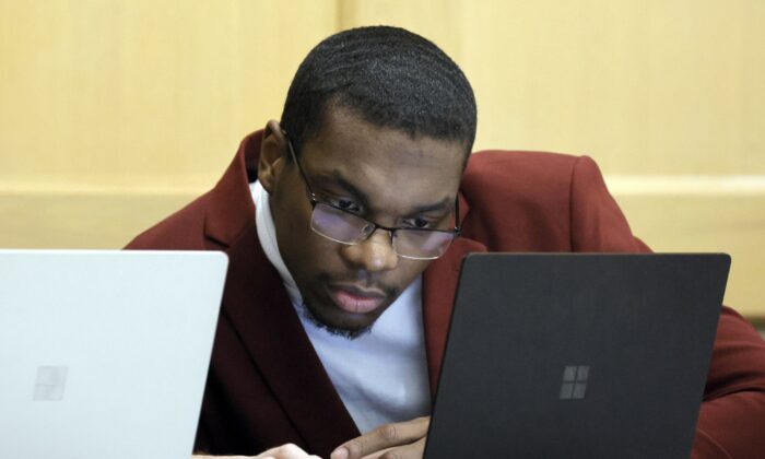 Shooting suspect Michael Boatwright looks at his attorney's computer at the defense table on the fourth day of jury deliberations in the XXXTentacion murder trial at the Broward County Courthouse in Fort Lauderdale, Fla., on March 13, 2023. (Amy Beth Bennett/South Florida Sun-Sentinel via AP, Pool)