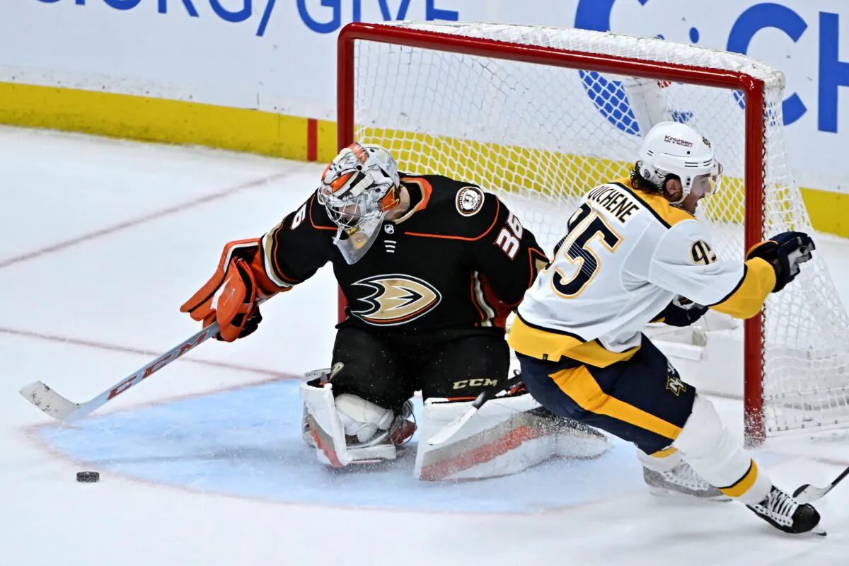 Anaheim Ducks goaltender John Gibson (L), sweeps away the puck on a shot by Nashville Predators center Matt Duchene during overtime of an NHL hockey game in Anaheim, Calif., on March 12, 2023. (Alex Gallardo/AP Photo)