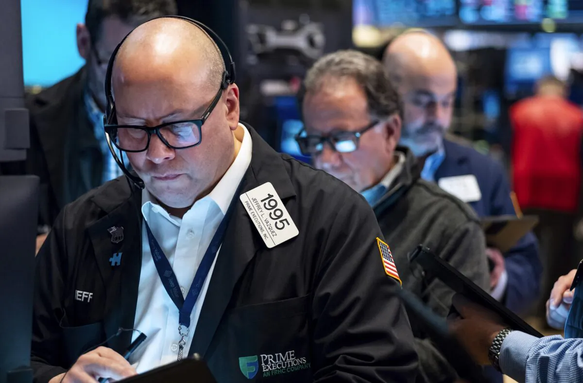 Traders work on the floor at the New York Stock Exchange on March 13, 2023. (Craig Ruttle/AP Photo)