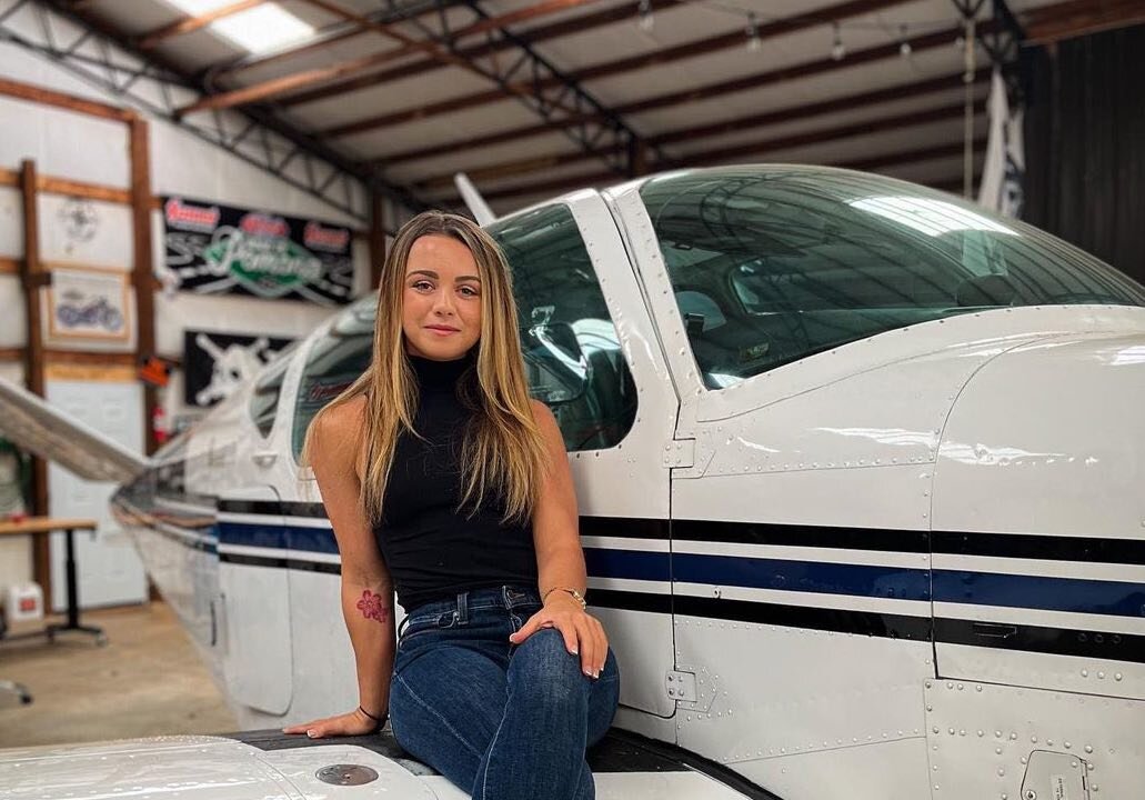 Sierra Lund, a recreational pilot, is pictured with a small airplane in 2022. (Courtesy of Sierra Lund.)
