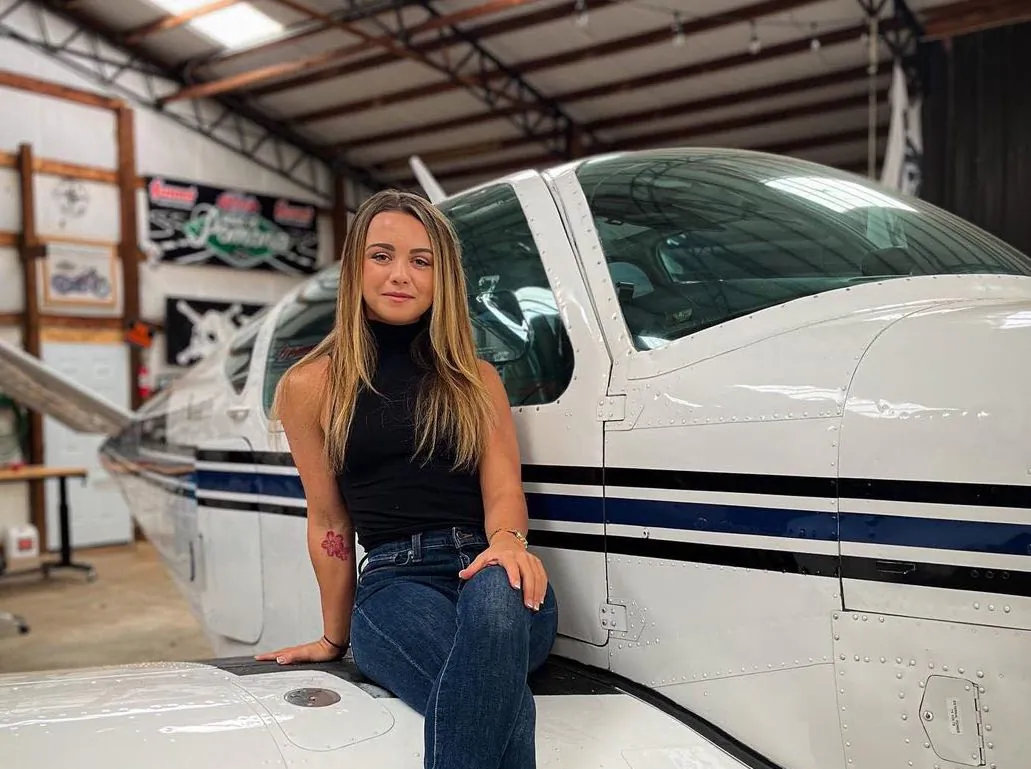 Sierra Lund, a recreational pilot, is pictured with a small airplane in 2022. (Courtesy of Sierra Lund.)
