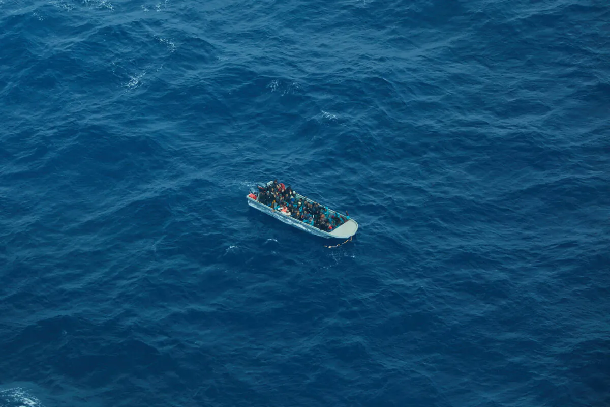 Aerial view shows a packed migrant boat en route from Libya in the central Mediterranean Sea in this handout image on March 11, 2023. (Christian Ghodes/Sea-Watch.org/Handout via Reuters)