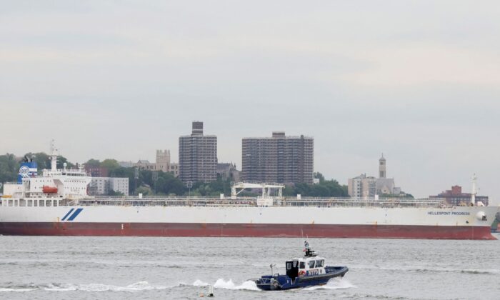 A New York City Police (NYPD) boat passes by the Hellespont Progress, an oil tanker anchored in New York Harbor in New York City on May 24, 2022. (Brendan McDermid/Reuters)