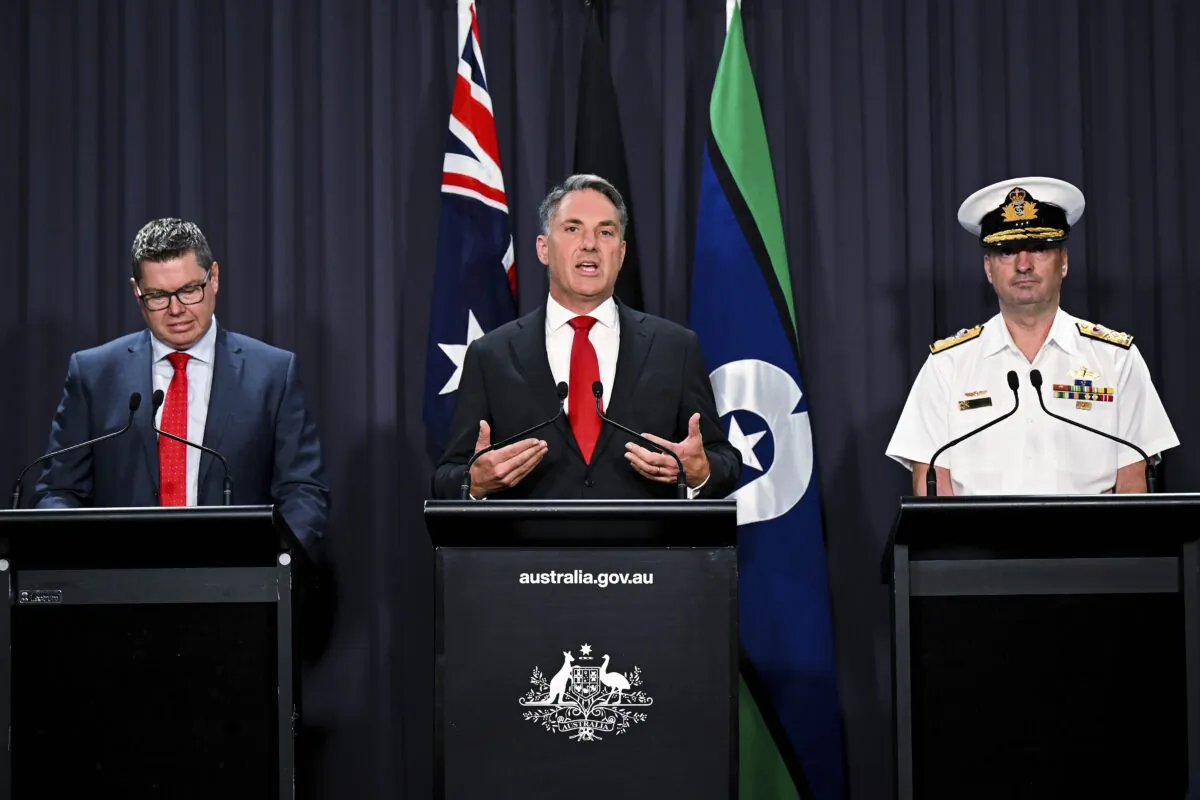 (L–R) Australian Defense Industry Minister Pat Conroy, Australian Deputy Prime Minister Richard Marles, and head of the Nuclear Powered Submarine Task Force Vice Adm. Jonathan Mead speak to the media during a press conference at Parliament House in Canberra, Australia, on March 14, 2023. (Lukas Coch/AAP Image via AP)