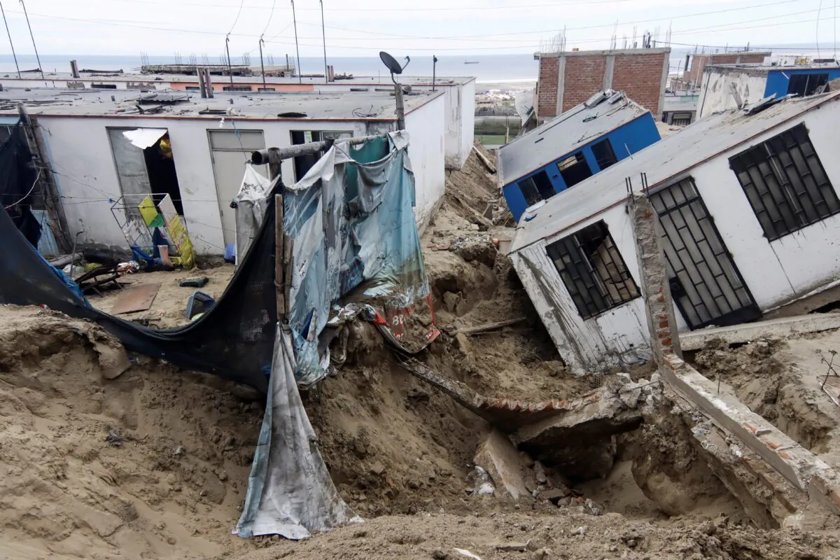 The damaged houses in the aftermath of the Moche river overflowing due to torrential rains caused by Cyclone Yaku, in Trujillo, Peru, on March 13, 2023. (Randy Reyes/Reuters)