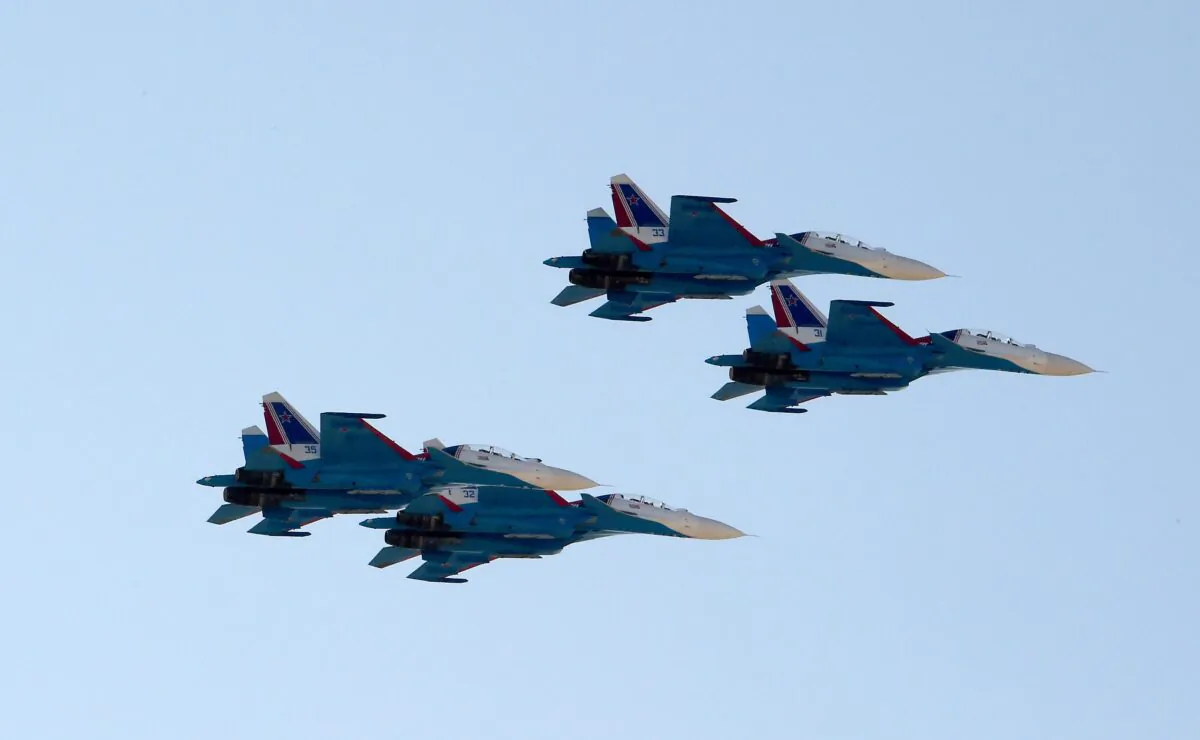 Russian Su-27s fly in a file image. (STR/AFP via Getty Images)
