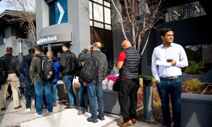 Silicon Valley Bank customers wait in line at SVB's headquarters in Santa Clara, Calif., on March 13, 2023. (Noah Berger/AFP via Getty Images)