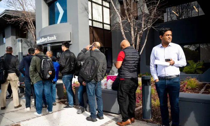 Silicon Valley Bank customers wait in line at SVB headquarters in Santa Clara, Calif., on March 13, 2023. (Noah Berger/AFP via Getty Images)