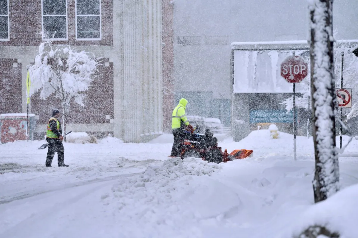 A worker plows snow on a street in Pittsfield, Mass., on March 14, 2023. (Ben Garver/The Berkshire Eagle via AP)