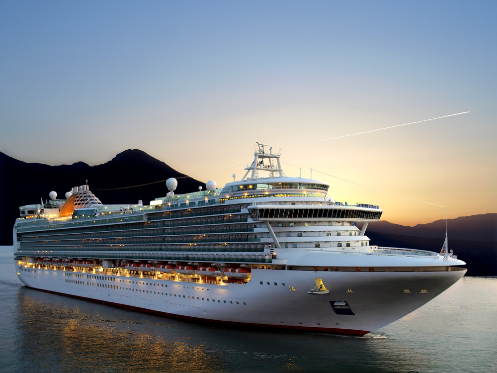 Luxury,Cruise,Ship,Sailing,From,Port,On,Sunrise.