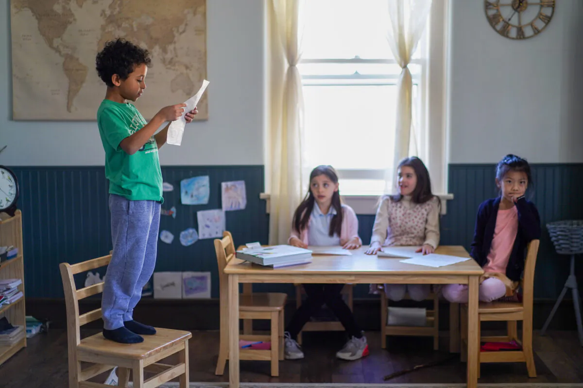 A student reads a poem at the Northern Schoolhouse in Middletown, N.Y., on Feb. 13, 2023. (Cara Ding/The Epoch Times)