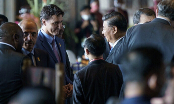 On Nov. 15, 2022, Canadian Prime Minister Justin Trudeau attended the G-20 Leadership Summit in Bali, Indonesia, and briefly met with Xi Jinping, the leader of the Chinese Communist Party. According to media reports, Trudeau raised pressing concerns about the interference activities of the Chinese Communist Party in Canada. (Adam Scotti/Prime Minister's Office Canada/AFP)