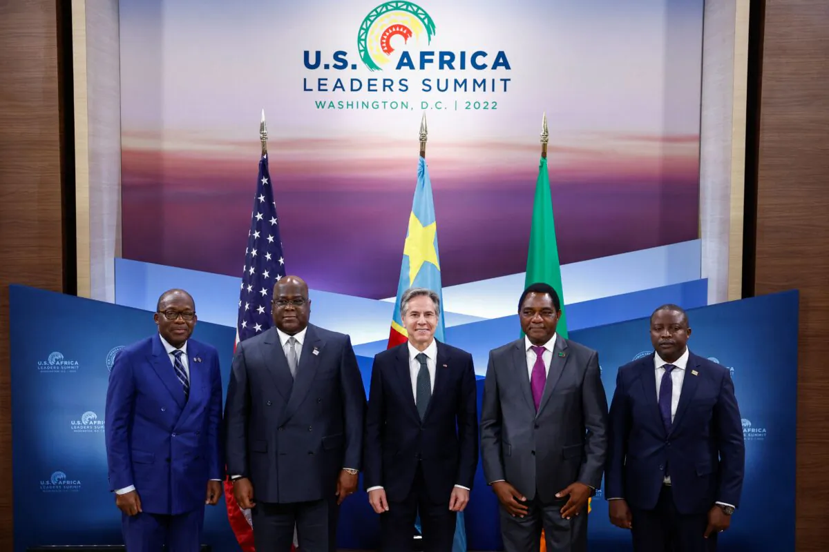 U.S. Secretary of State Antony Blinken (C) poses with Democratic Republic of the Congo (DRC) Foreign Minister Christophe Lutundula (L), DRC President Felix Tshisekedi (2nd L), Zambia's President Hakainde Hichilema (2nd R) and Zambian Foreign Minister Stanley Kakubo (R) during a memorandum of understanding signing ceremony in Washington, DC, on Dec. 13, 2022. (Evelyn Hockstein/POOL/AFP via Getty Images)