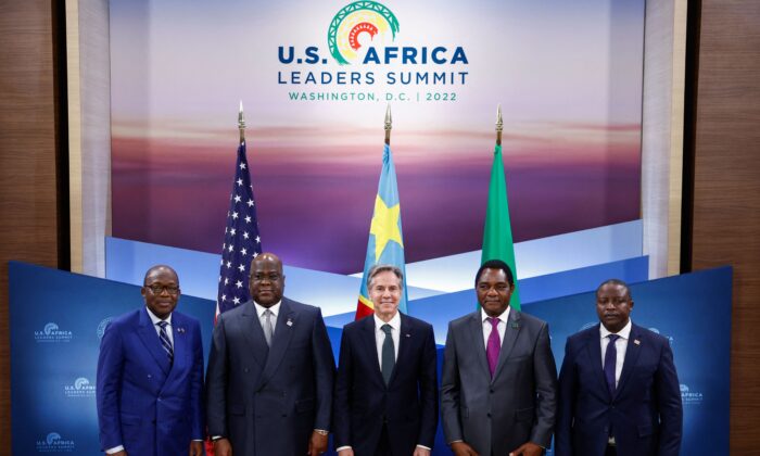 U.S. Secretary of State Antony Blinken (C) poses with Democratic Republic of the Congo (DRC) Foreign Minister Christophe Lutundula (L), DRC President Felix Tshisekedi (2nd L), Zambia's President Hakainde Hichilema (2nd R) and Zambian Foreign Minister Stanley Kakubo (R) during a memorandum of understanding signing ceremony in Washington, DC, on Dec. 13, 2022. (Evelyn Hockstein/POOL/AFP via Getty Images)