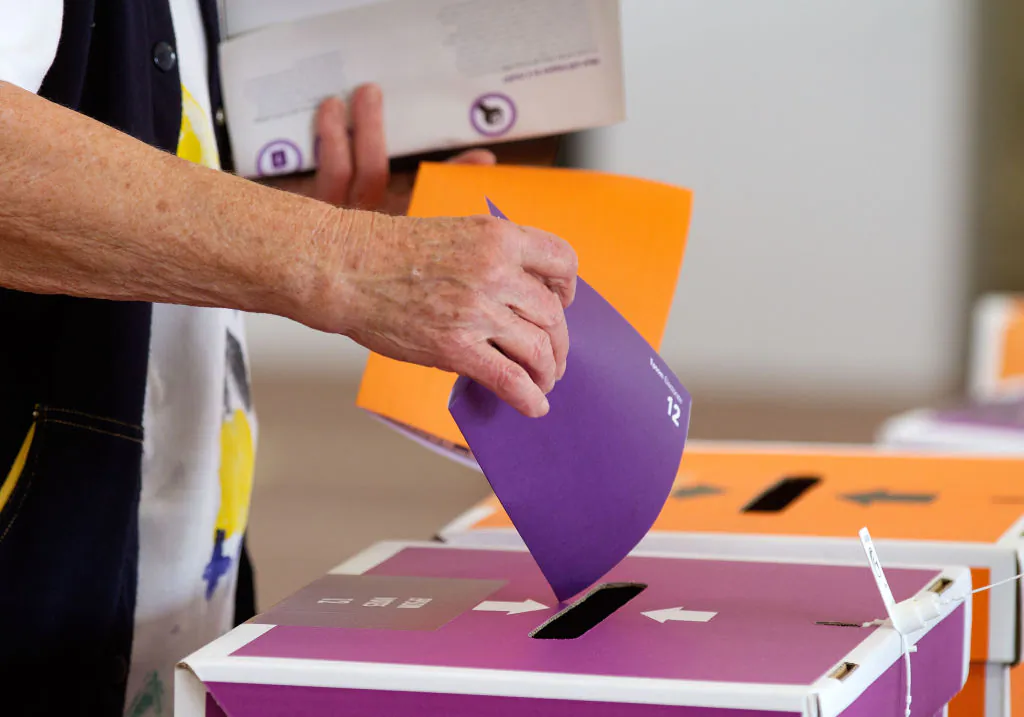 A voter casts his ballot in the general election at a polling center in Auckland, New Zealand, on Nov. 26, 2011. (Marty Melville/AFP via Getty Images)