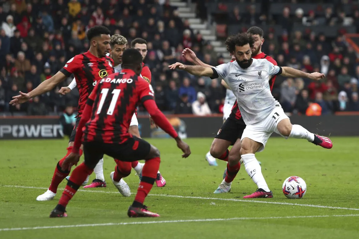 Liverpool's Mohamed Salah (R) attempts a shot on goal during the English Premier League soccer match between Bournemouth and Liverpool at the Vitality Stadium, Bournemouth, England, on March 11, 2023. (Kieran Cleeves/PA via AP)