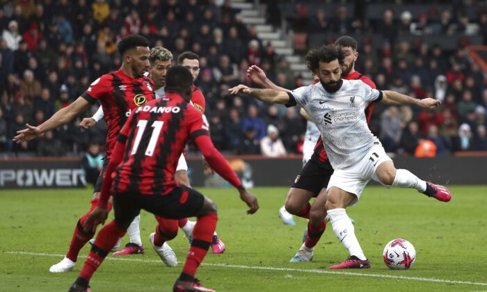 Liverpool's Mohamed Salah (R) attempts a shot on goal during the English Premier League soccer match between Bournemouth and Liverpool at the Vitality Stadium, Bournemouth, England, on March 11, 2023. (Kieran Cleeves/PA via AP)