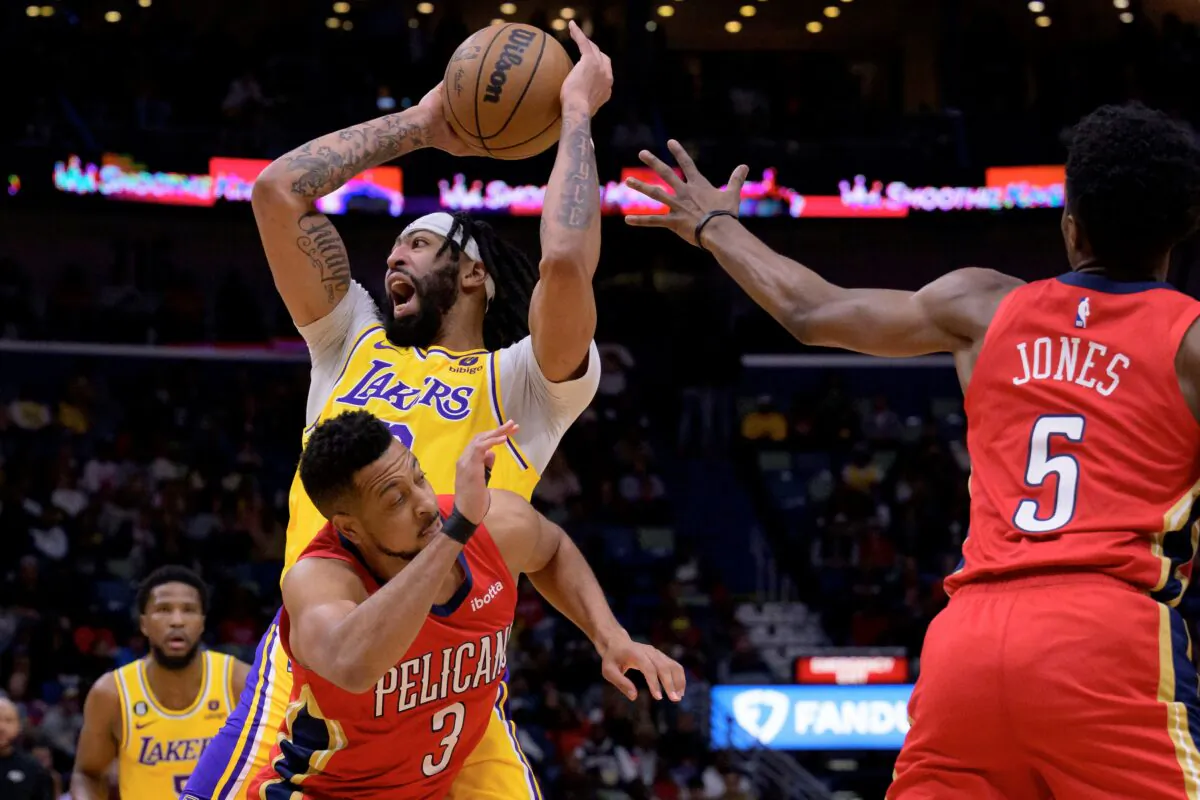 Los Angeles Lakers forward Anthony Davis (3) shoots against New Orleans Pelicans guard CJ McCollum (3) in the first half of an NBA basketball game in New Orleans, on March 14, 2023. (Matthew Hinton/AP Photo)