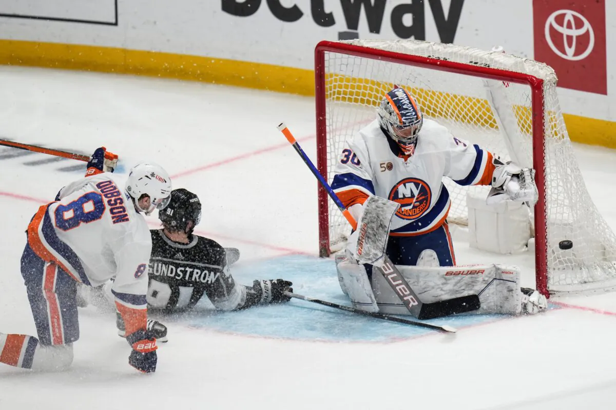 New York Islanders goaltender Ilya Sorokin (30) deflects the puck hit by Los Angeles Kings' Carl Grundstrom (91) during the second period of an NHL hockey game in Los Angeles on March 14, 2023. (Jae C. Hong/AP Photo)
