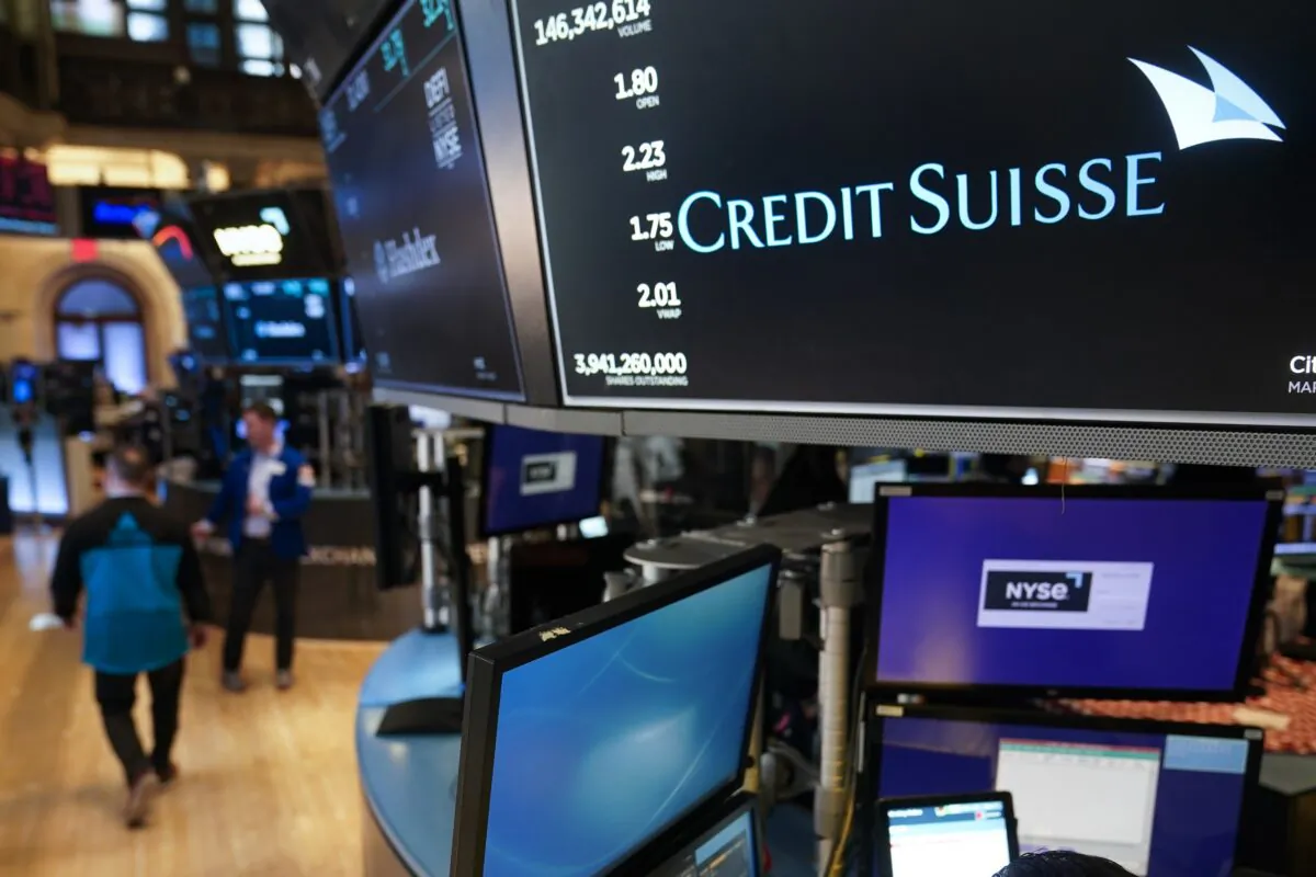 A sign displays the name of Credit Suisse on the floor at the New York Stock Exchange on March 15, 2023. (Seth Wenig/AP Photo)