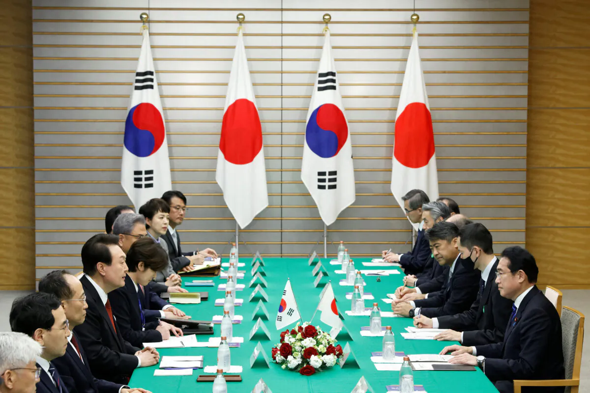 Japan's Prime Minister Fumio Kishida and South Korea's President Yoon Suk-yeol attend a meeting at the prime minister's official residence in Tokyo, Japan, on March 16, 2023. (Kiyoshi Ota/Pool via Reuters)