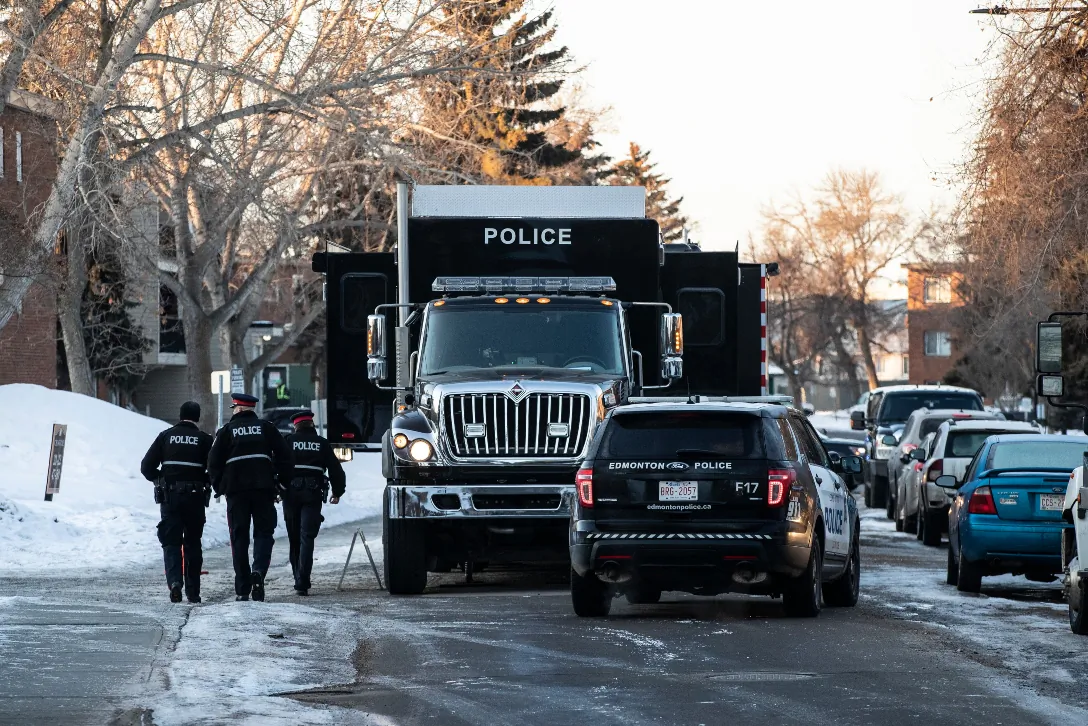 Police investigate the scene where two officers were shot and killed on duty in Edmonton on March 16, 2023. (Jason Franson/The Canadian Press)