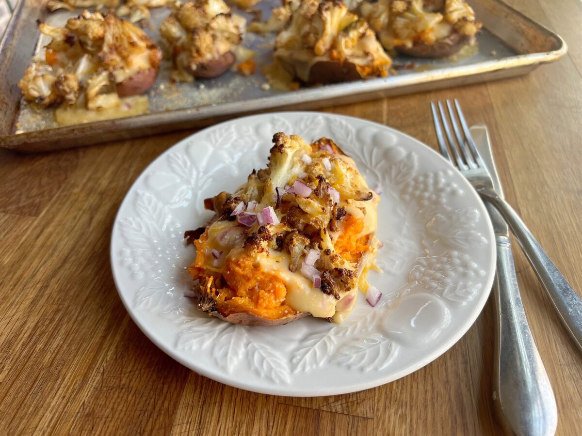 Sweet potatoes stuffed with cheesy, roasted cauliflower make a quick and easy vegetarian dinner. (Gretchen McKay/Pittsburgh Post-Gazette/TNS)