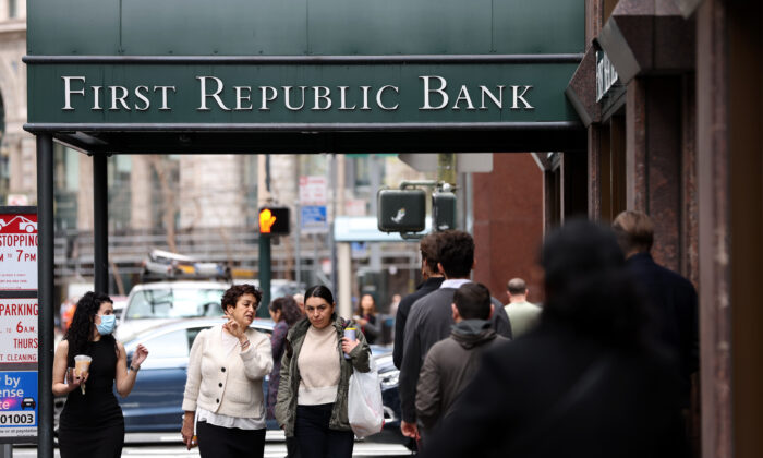 People walk by the First Republic Bank headquarters in San Francisco, Calif., on March 13, 2023. (Photo by Justin Sullivan/Getty Images)