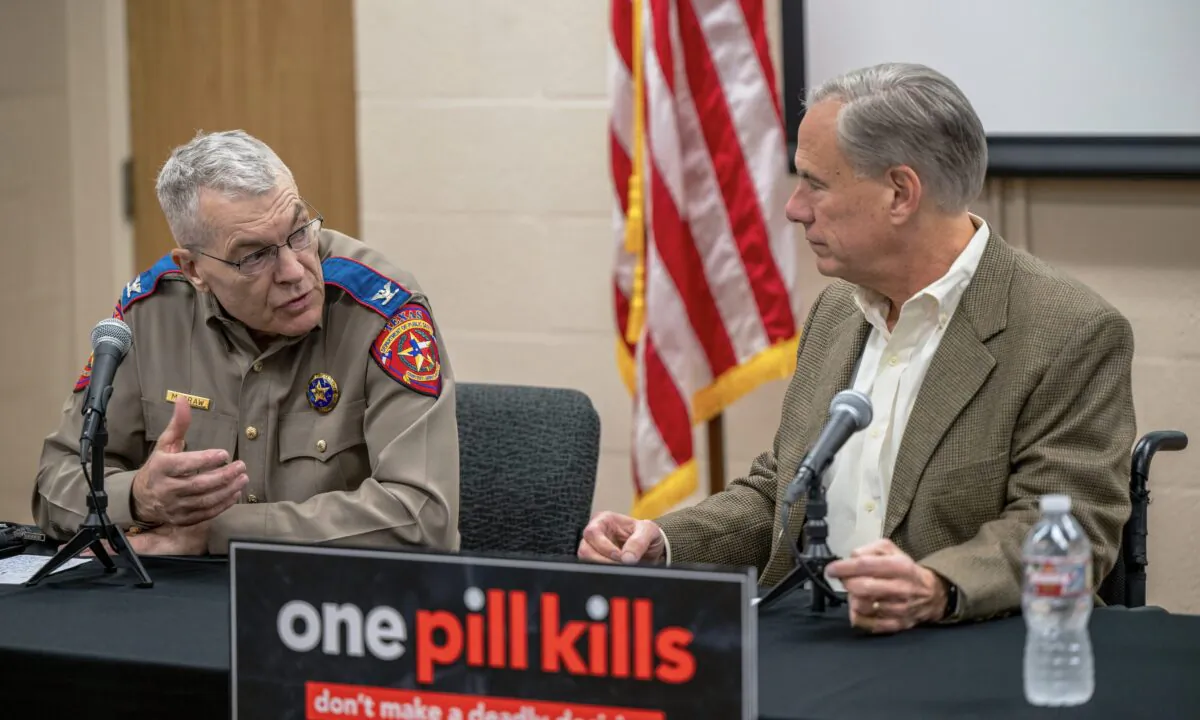Texas Department of Public Safety Director Steve McCraw speaks with Gov. Greg Abbott at a news conference to discuss measures to address the problem of fentanyl in the state, in Beaumont, Texas, on Oct. 17, 2022. (Brandon Bell/Getty Images)
