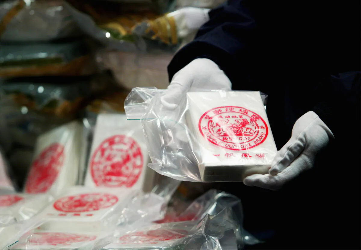 Australian Federal Police display 75 kilograms of heroin at a press conference in Melbourne, Australia, on May 27, 2003. (Sean Garnsworthy/Getty Images)