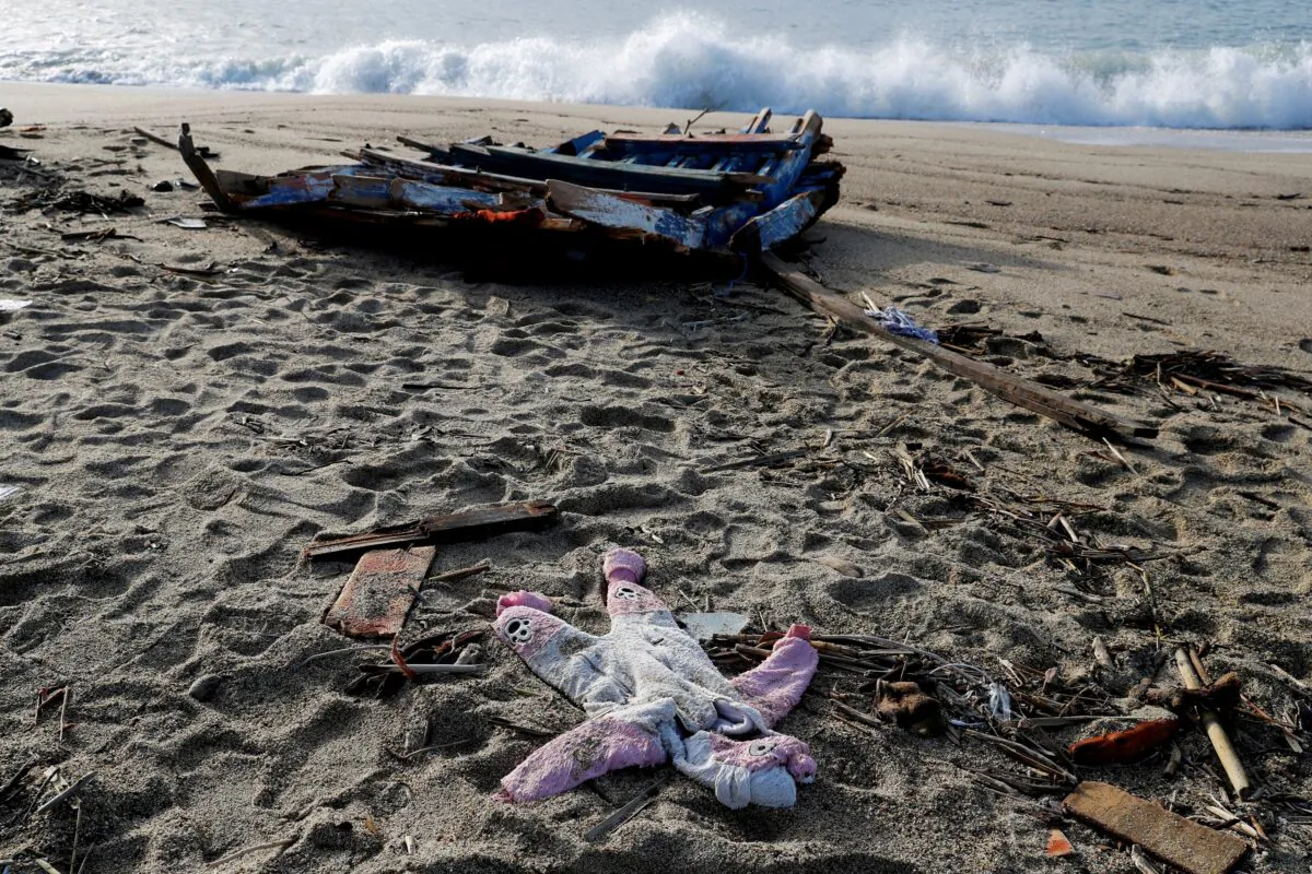 A piece of the boat and a piece of clothing from the deadly migrant shipwreck are seen in Steccato di Cutro near Crotone, Italy, on Feb. 28, 2023. (Remo Casilli/Reuters)