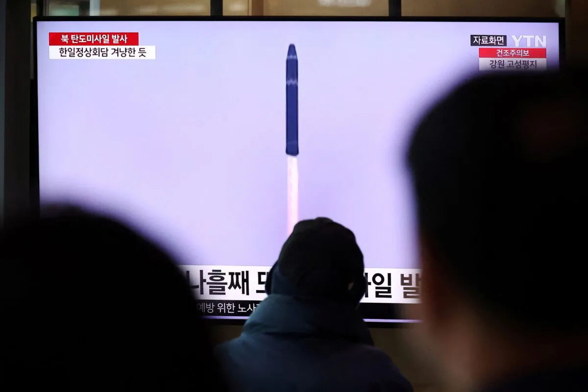 People watch a TV broadcasting a news report on North Korea firing a ballistic missile into the sea off its east coast, at a railway station in Seoul, South Korea, on March 16, 2023. (Kim Hong-Ji/Reuters)