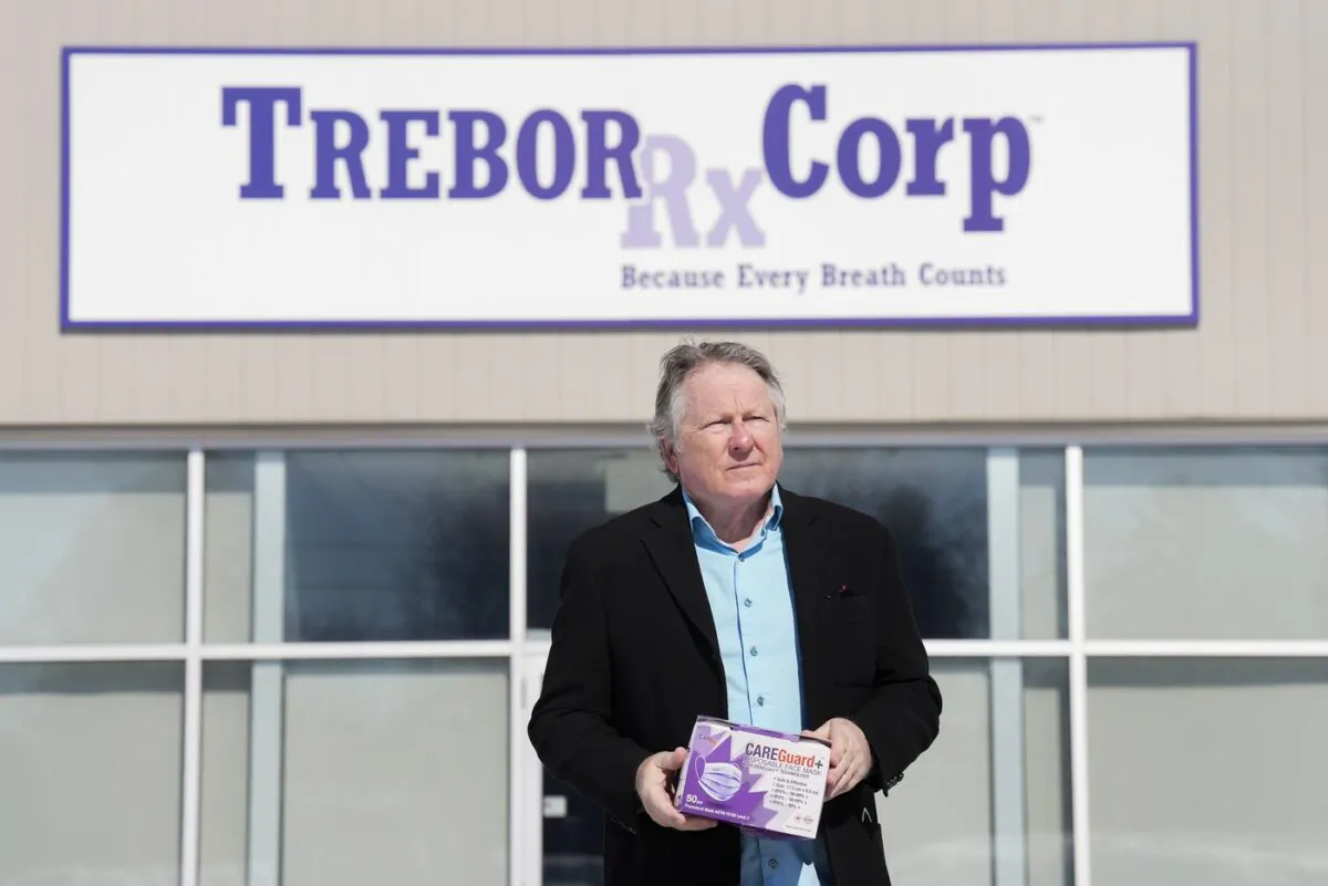 George Irwin, owner of Trebor RX Corp., which manufactured PPE masks for the COVID-19 pandemic, poses for a photograph outside what was his business before it went into receivership in Collingwood, Ont., on March 15, 2023. (The Canadian Press/Nathan Denette)