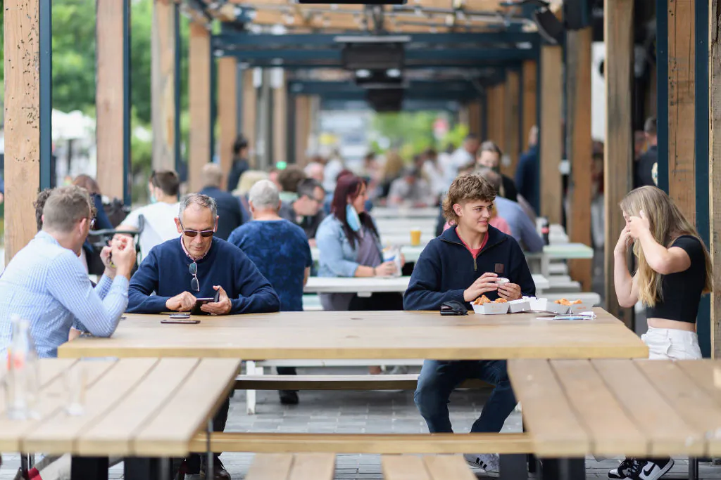 Members of the public enjoy their lunch at Riverside Market in Christchurch, New Zealand, on Dec. 3, 2021. (Kai Schwoerer/Getty Images)