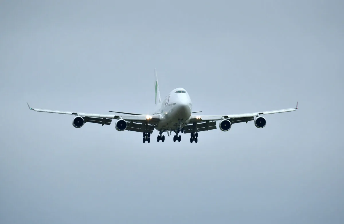 A flight carrying passengers from China is seen before landing at RAF Brize Norton near Oxford, Britain, on Jan. 31, 2020. (Dylan Martinez/Reuters)