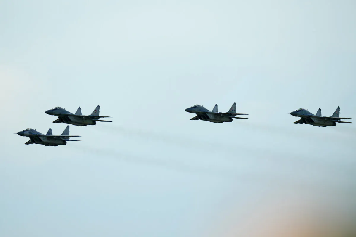 Slovak Air Force MiG-29s fly over an airport during an airshow in Malacky, Slovakia, on Aug. 27, 2022. (Petr David Josek/AP Photo)