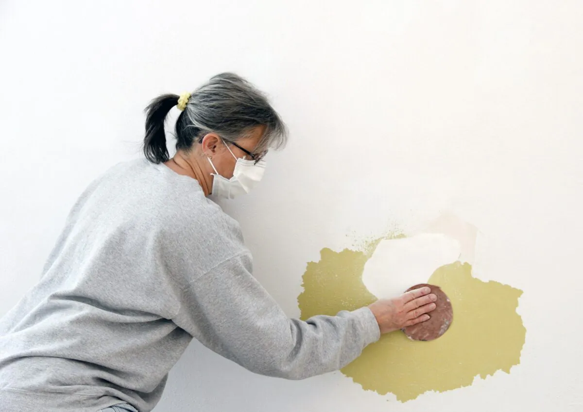 If the damage is larger than a coin-sized hole, the repair may require a patch of drywall. (dcwcreations/Shutterstock)