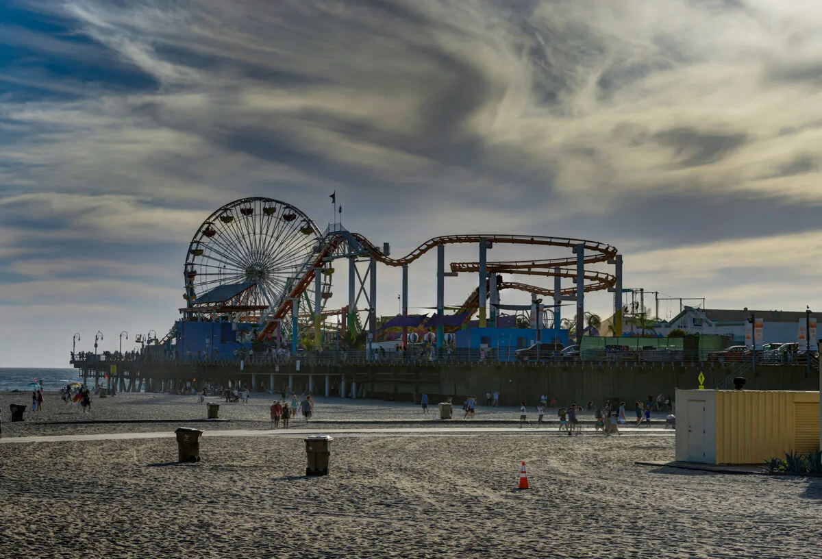 The famed Sea Dragon ship at Pacific Park was retired Thursday as a helicopter lifted it off the pier. Bystanders captured pictures and video as the dragon flew past Santa Monica. (Dreamstime/TNS)