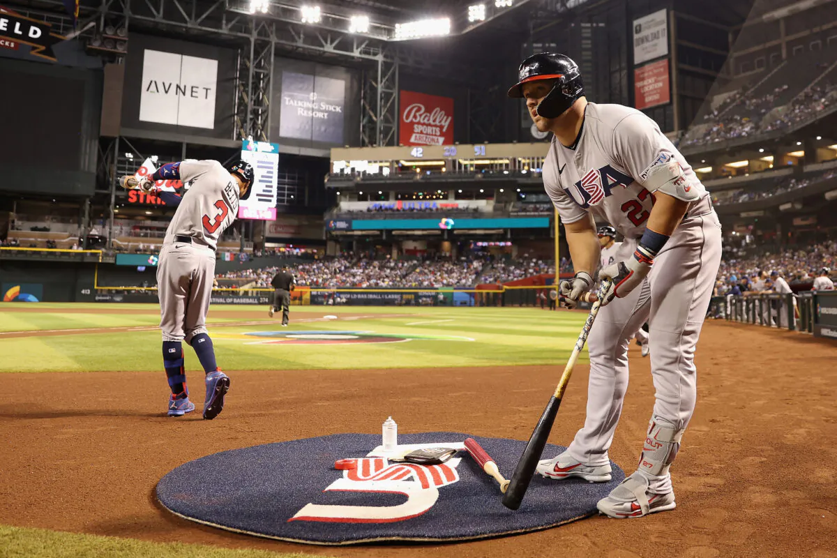 Mike Trout (27) and Mookie Betts (3) of Team USA warm up on deck during the first inning of the World Baseball Classic Pool C game against Team Colombia at Chase Field in Phoenix on March 15, 2023. (Christian Petersen/Getty Images)